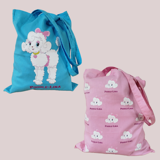 Two tote bags, one blue with a cartoon poodle and the other pink with an all-over-pattern of cartoon dogs, on a light cream background.