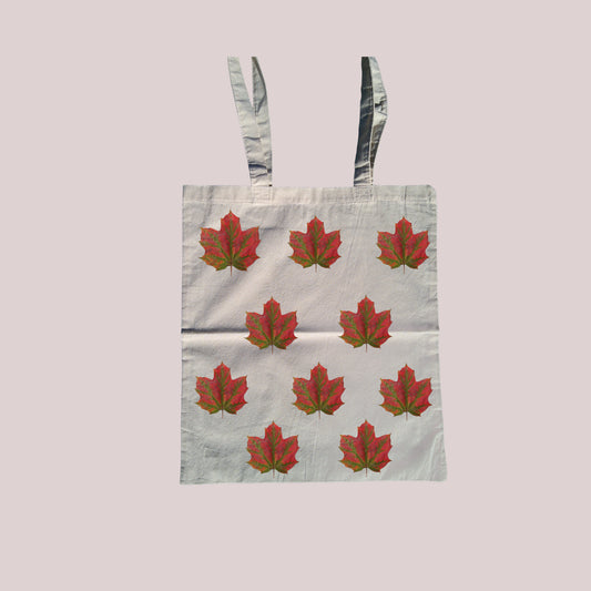 Red and green leaf print tote bag