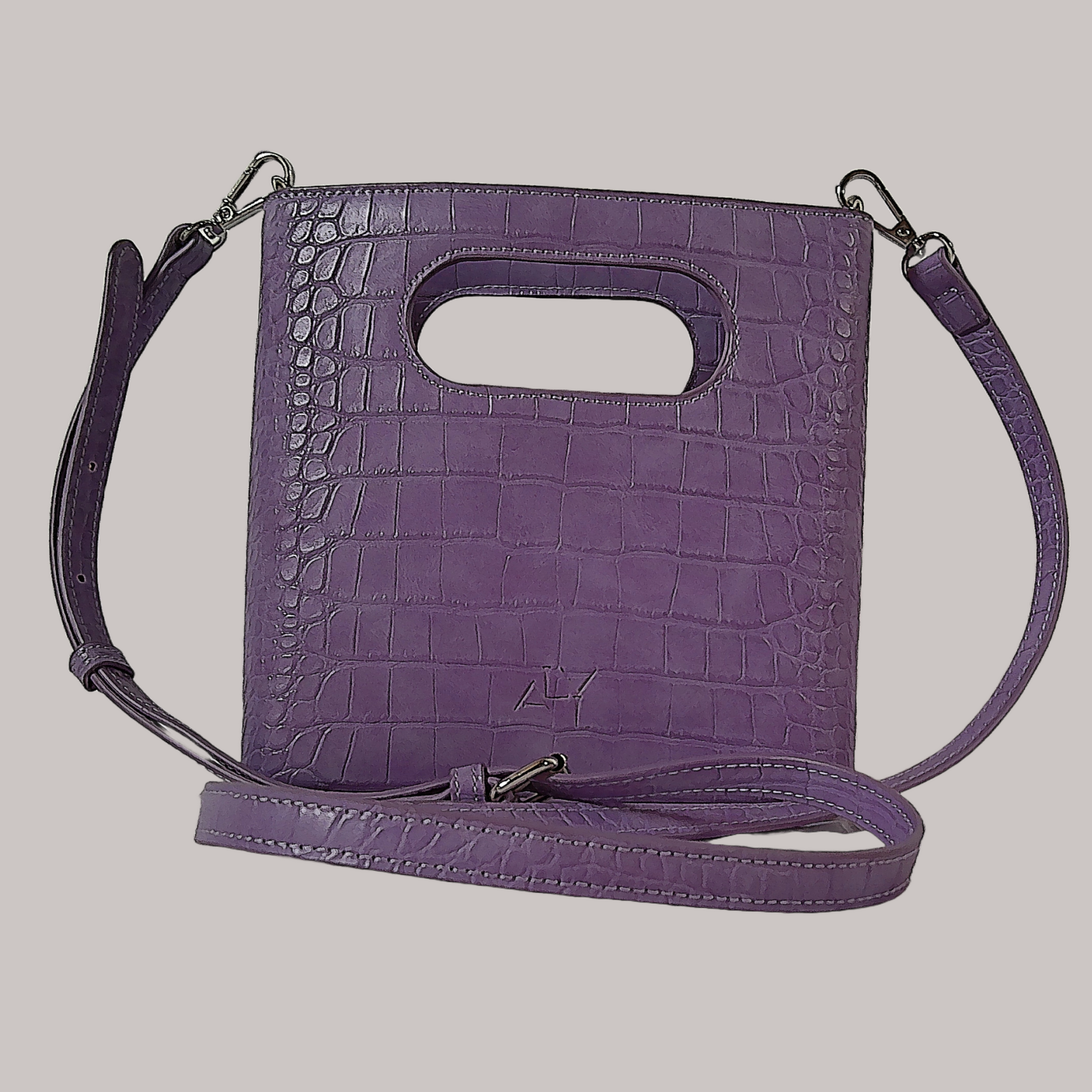 Square shaped light purple women's hand bag with removable and adjustable strap